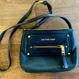 michael kors black leather messenger bag with gold accents